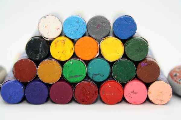 Colorful crayons on a white background. Space for text.