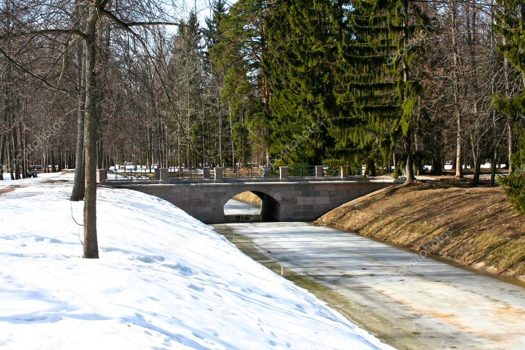 A pond with a bridge near the Kamennoe Zalo Palace in Oranienbaum Park. St. Petersburg, Lomonosov.
