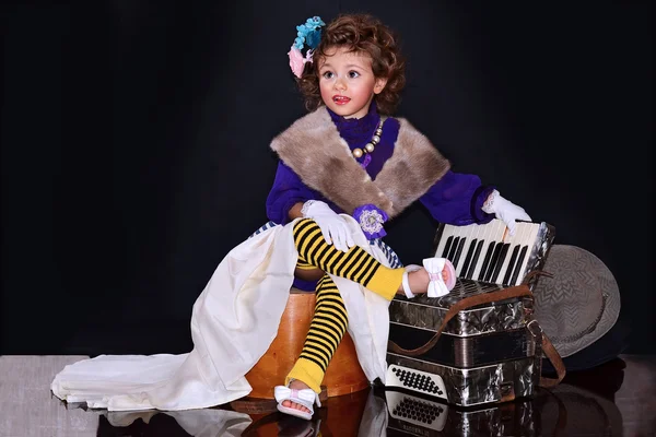 Cute baby with an accordion — Stock Photo, Image