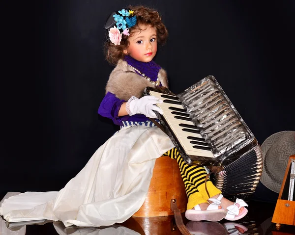 Cute baby with an accordion — Stock Photo, Image