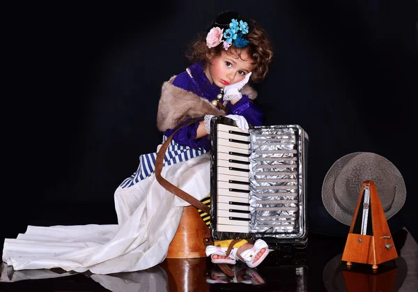 Cute baby with an accordion — Stock Photo, Image