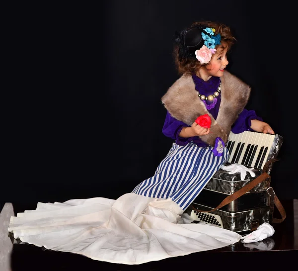 Cute baby with an accordion — Stock Photo, Image