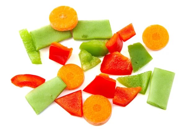 Chopped vegetables. Red, green pepper, carrot and beans on white background. — Stock Photo, Image