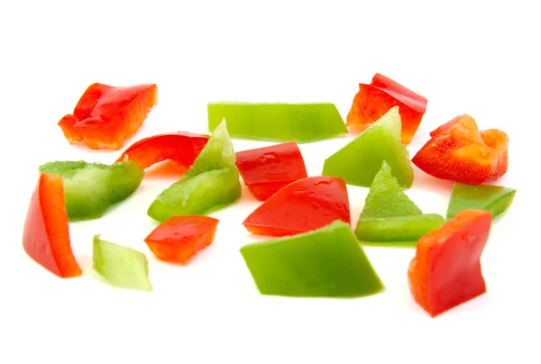 Chopped red and green pepper on white background. — Stock Photo, Image