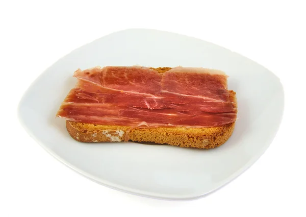 Serrano ham whith bread. Spanish tapa. Mediterranean diet. — Stock Photo, Image