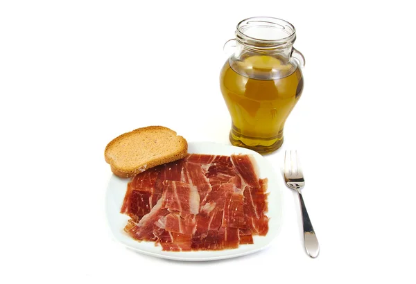 Jamón serrano, pan y aceite de oliva virgen extra. Jabugo. Dieta mediterránea . — Foto de Stock