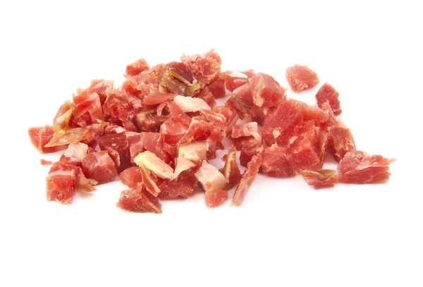 Bunch of sliced spanish serrano ham on white background — Stock Photo, Image