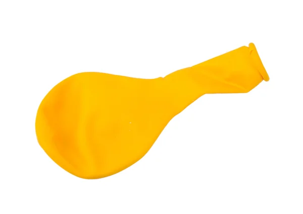 Not inflated yellow air balloon isolated on a white background — Stock Photo, Image