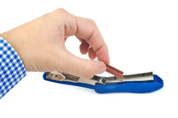 Man hand refilling a green stapler on white background — Stock Photo, Image