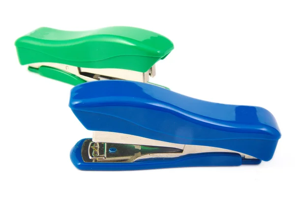 Two green and blue staplers on a white background — Stock Photo, Image