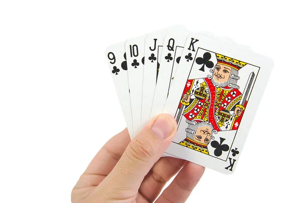 Beyaz bir arka plan üzerinde kulüplerde bir floş royal iskambil poker eli — Stok fotoğraf