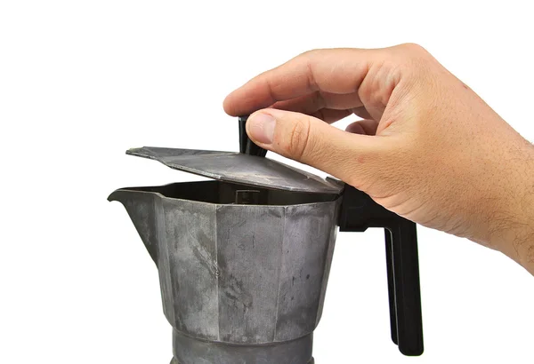 Man hand opening an old, used and rusty italian coffee maker isolated on a white background — Stock Photo, Image