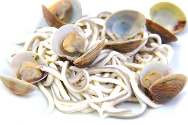 Baby eels or elver substitute with clams in garlic sauce. Traditional Spanish tapa. Gulas al ajillo clipart