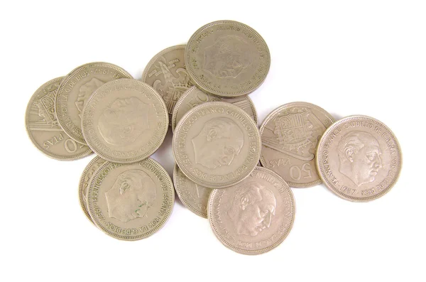 Bunch of old Spanish coins of 50 pesetas showing Franco dictator face on a white background. 1957 — Stock Photo, Image