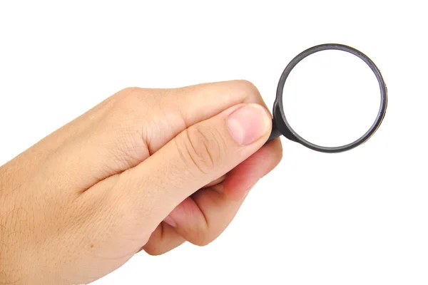 Mans hand, holding a black magnifying glass isolated on a white background — Stock Photo, Image