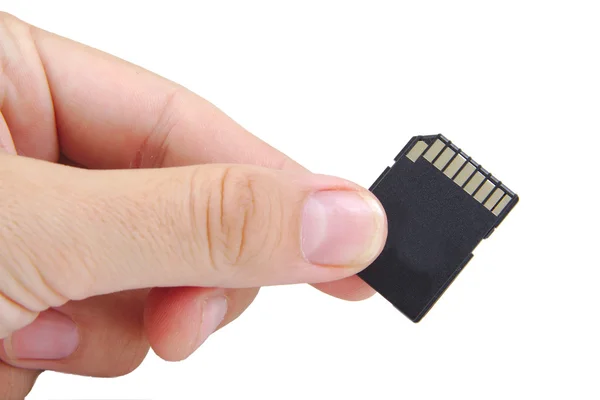 Flash card in hand geïsoleerd op een witte achtergrond — Stockfoto