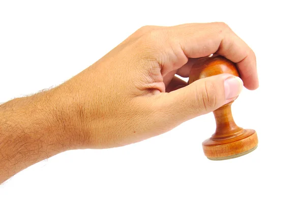 Hand stamping with an old and vintage wooden stamper isolated on a white background — Stock Photo, Image