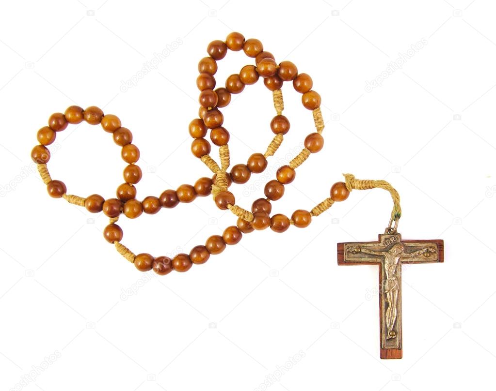 Wooden rosary beads and cross isolated on a white background