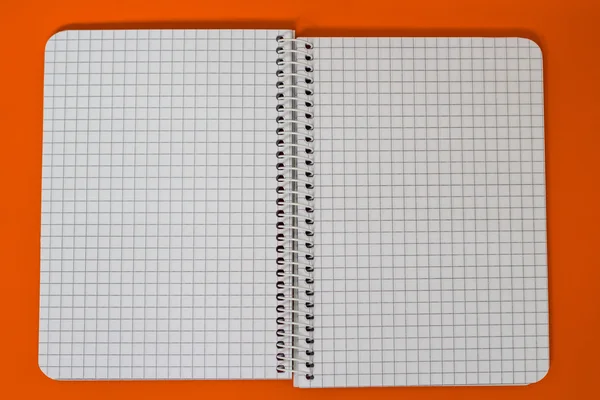 Spiral Notebook at orange Background. — Stock Photo, Image