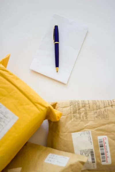 Blank letter  and Parcels. — Stock Photo, Image