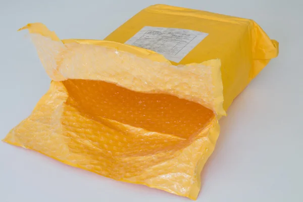 Empty yellow parcel. — Stock Photo, Image