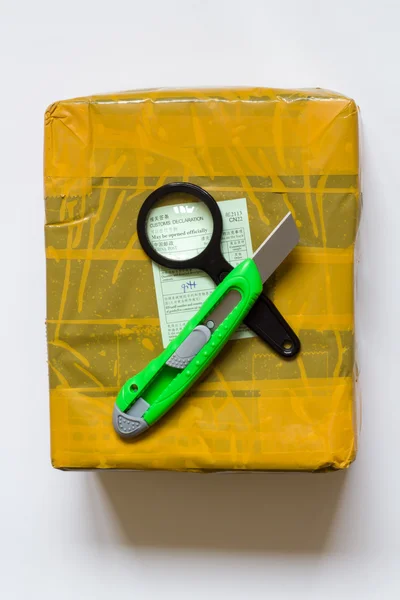 Unboxing yellow parcel from China. — Stock Photo, Image