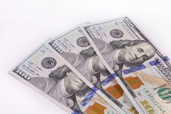 stack of one hundred dollar bills U.S. on white background