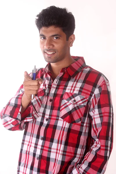 Young confident indian teenager guy smiling and pointing at camera — Stock Photo, Image