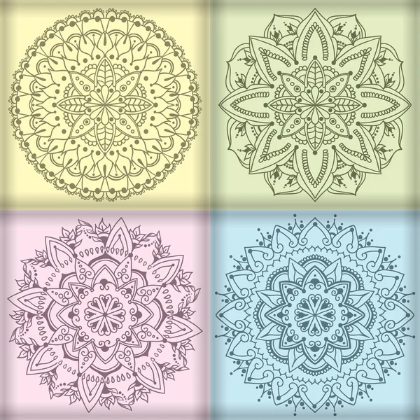 Vier cirkelvormige floral ornamenten — Stockvector
