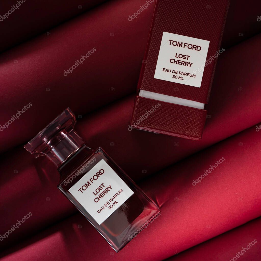 Kirov Russia 15 November 2020 Tom Lost cherry niche luxury perfumery boutique perfume fragnance on a juicy red background.
