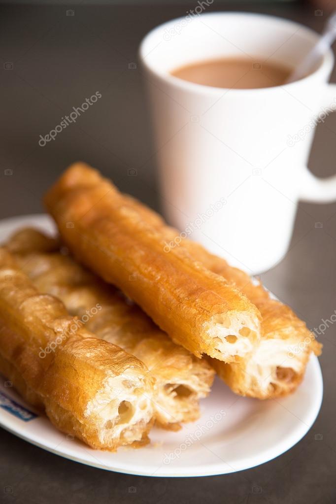 Chinese doughnut or You Tiao with milky tea