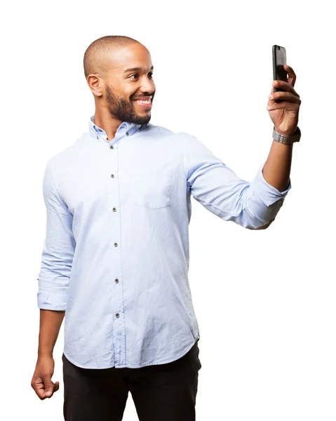 Black businessman with mobile phone — Stock Photo, Image