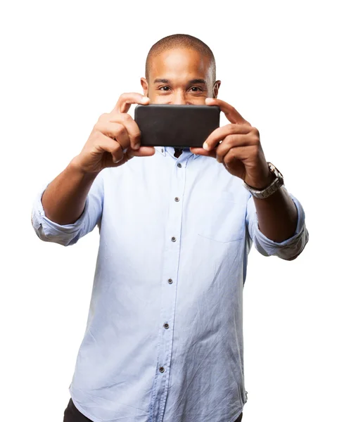 Black businessman with mobile phone — Stock Photo, Image