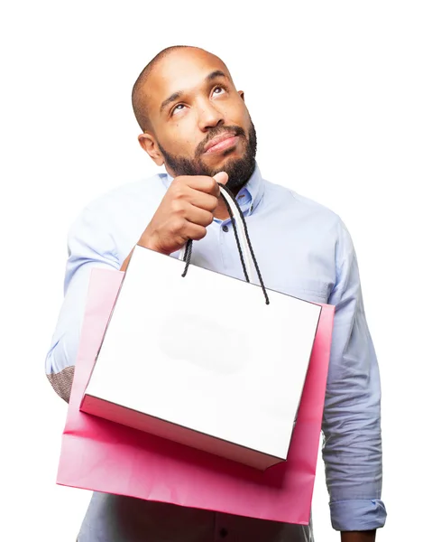 Homem de negócios preto com sacos de compras — Fotografia de Stock