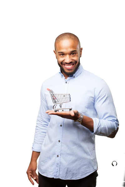 Hombre de negocios negro con carrito de compras de juguete — Foto de Stock