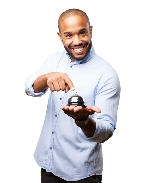 Black businessman with bell — Stock Photo, Image