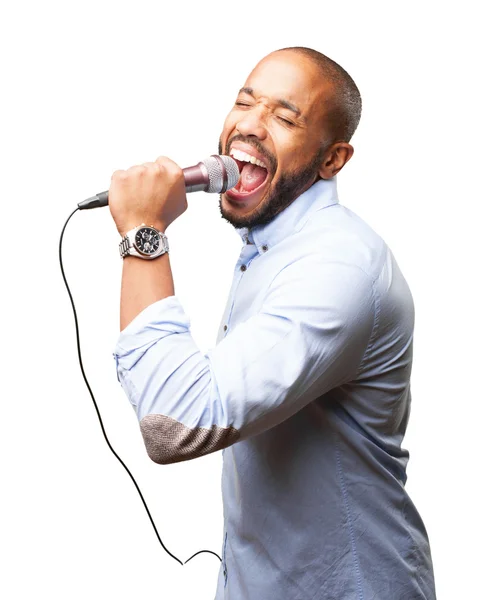 Biznesmen czarny śpiewa do mikrofonu — Zdjęcie stockowe