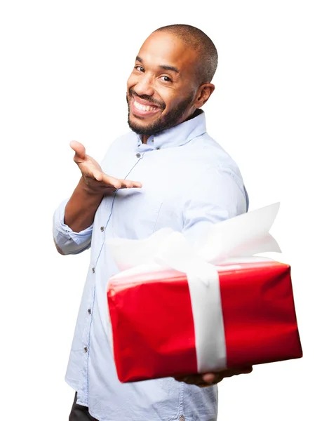 Black businessman with gift box — Stock Photo, Image