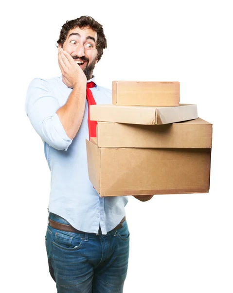 Crazy businessman with cardboard boxes — Stock Photo, Image