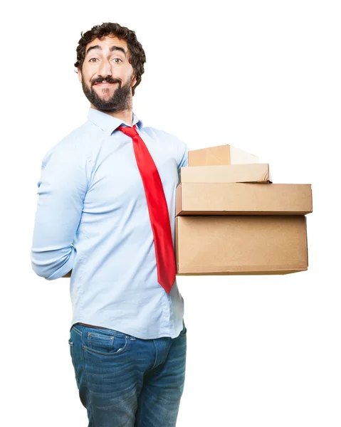 Crazy businessman with cardboard boxes — Stock Photo, Image