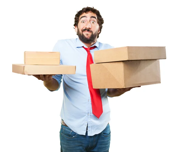 Crazy businessman with cardboard boxes — Stock Photo, Image