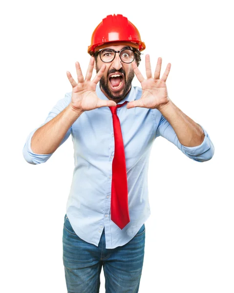 Businessman in building hat with angry expression — Stock Photo, Image