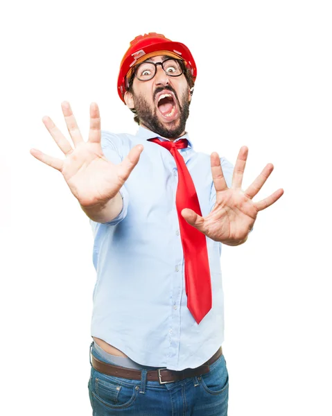 Бизнесмен в строительной шляпе с беспокойным выражением лица — стоковое фото