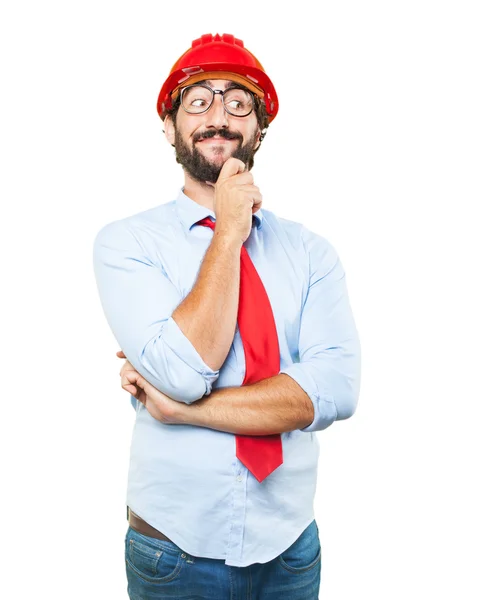 Hombre de negocios en el edificio sombrero con expresión feliz —  Fotos de Stock