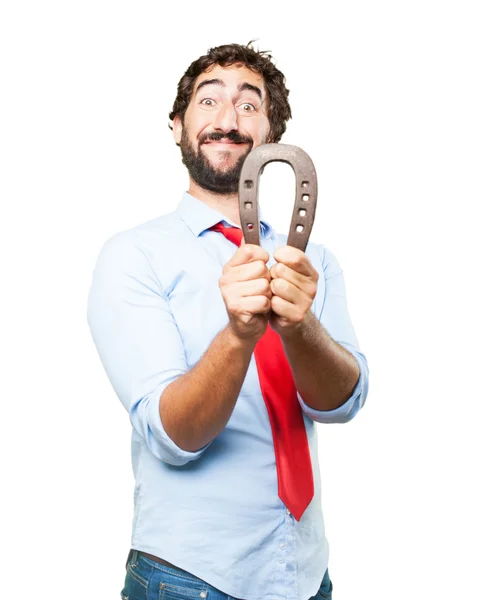 Crazy businessman with horseshoe — Stock Photo, Image