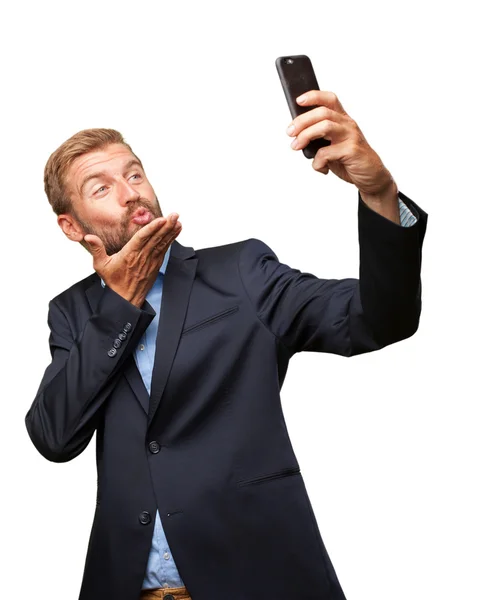 Crazy businessman doing selfie on mobile phone — Stock Photo, Image