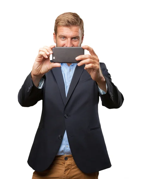 Crazy businessman doing selfie on mobile phone — Stock Photo, Image