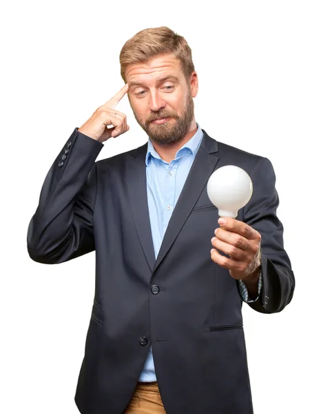 Blond businessman with lightbulb in her hand — Stock Photo, Image