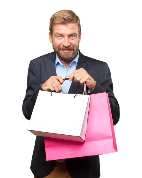 Blond zakenman met shopping tassen — Stockfoto
