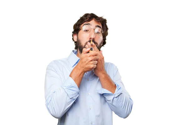 Crazy man smokes cigarette with expression — Stock Photo, Image